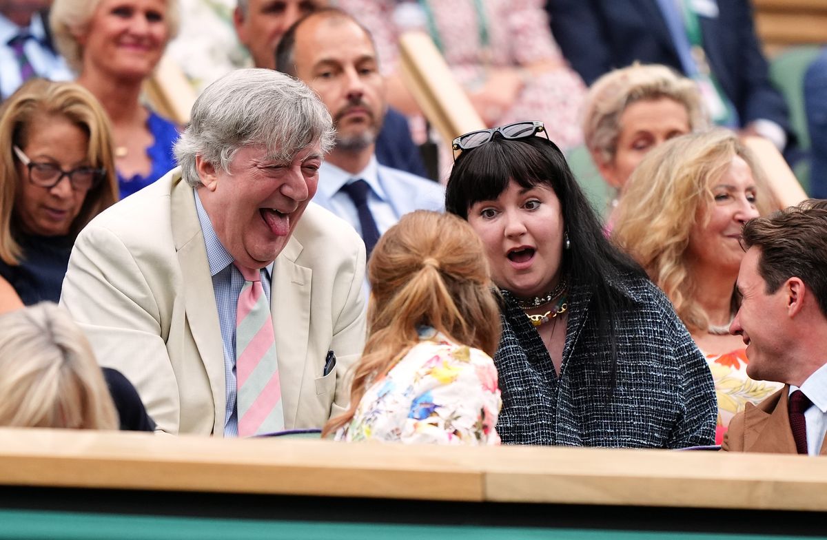 Stephen Fry and Lena Dunham in the royal box on day nine of the 2024 Wimbledon Championships at the All England Lawn Tennis and Croquet Club, London. Picture date: Tuesday July 9, 2024. (Photo by Zac Goodwin/PA Images via Getty Images)