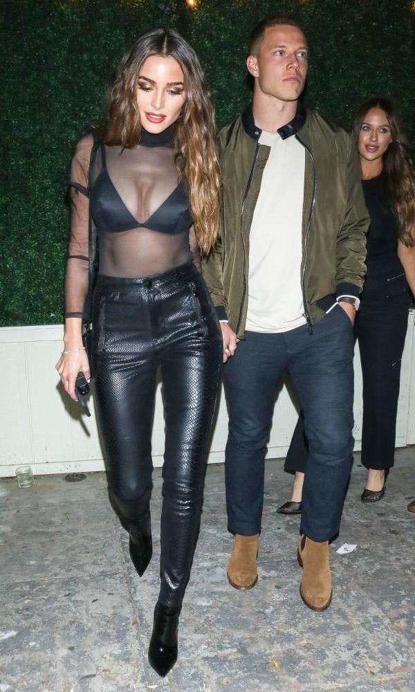 Olivia Culpo in the exposed bra and leather pants look