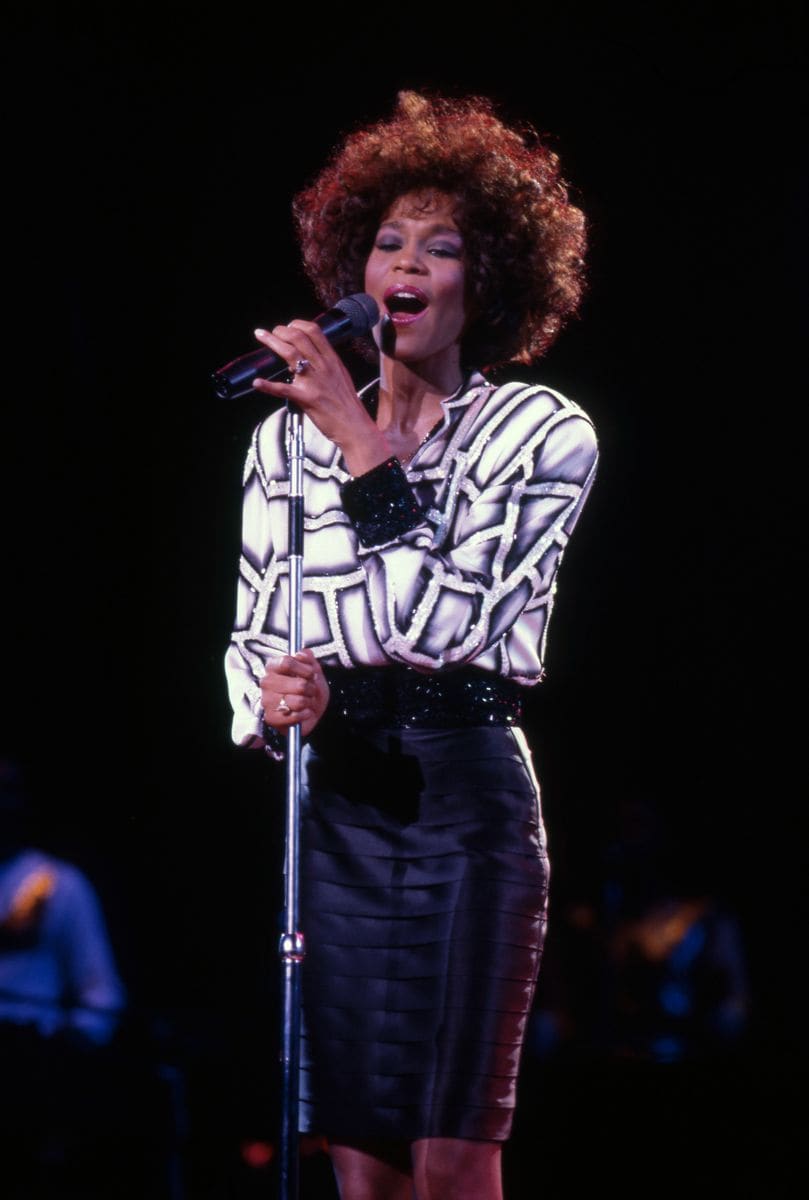 CLARKSTON - JULY 31:  American singer and actress, Whitney Houston, performs at the Pine Knob Music Theater during her "Moment of Truth" world tour, on July 31, 1987, in Clarkston, Michigan.  (Photo by Ross Marino/Getty Images)