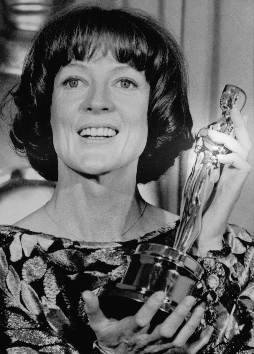 Actress Maggie Smith is all smiles as she holds up her "Oscar" which she won as Best Actress in a Supporting Role at the 51st Annual Academy Awards at the Music Center. She won it for her role in the comedy "California Suite".