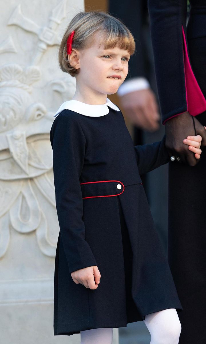 Princess Gabriella looked adorable wearing a navy dress that featured a white Peter Pan collar, teamed with white tights and red hair accessories.