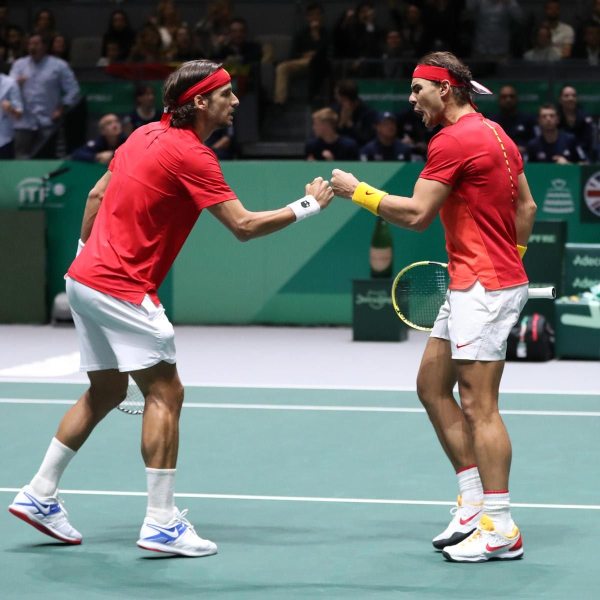 Rafael Nadal and Feliciano Lopez celebrating one of their wins   at the semi final match against Great Britain during the 2019 Davis Cup.