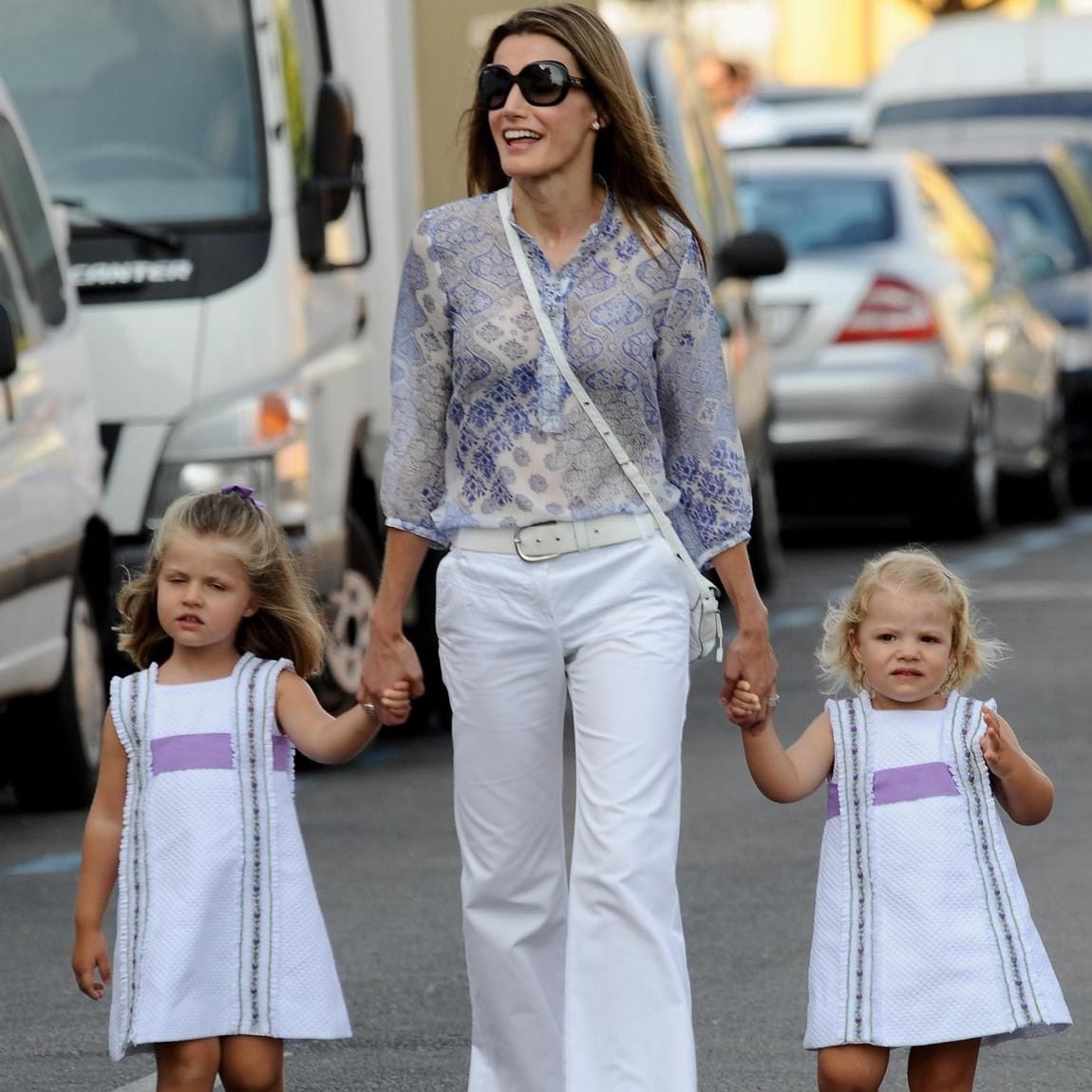 Letizia strolled hand-in-hand with her little girls while in Palma de Mallorca in 2009.