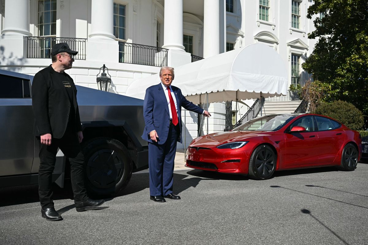 US President Donald Trump and Tesla CEO Elon Musk speak to the press as they stand next to Tesla vehicles on the South Portico of the White House on March 11, 2025 in Washington, DC. (Photo by Mandel NGAN / AFP) (Photo by MANDEL NGAN/AFP via Getty Images)          