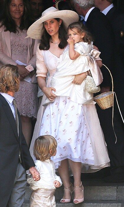 Tatiana Casiraghi wore a ladylike 1950s style skirt and wide-brimmed hat to the ceremony, carrying daughter India in her arms.
Photo: Gisela Schober/Getty Images