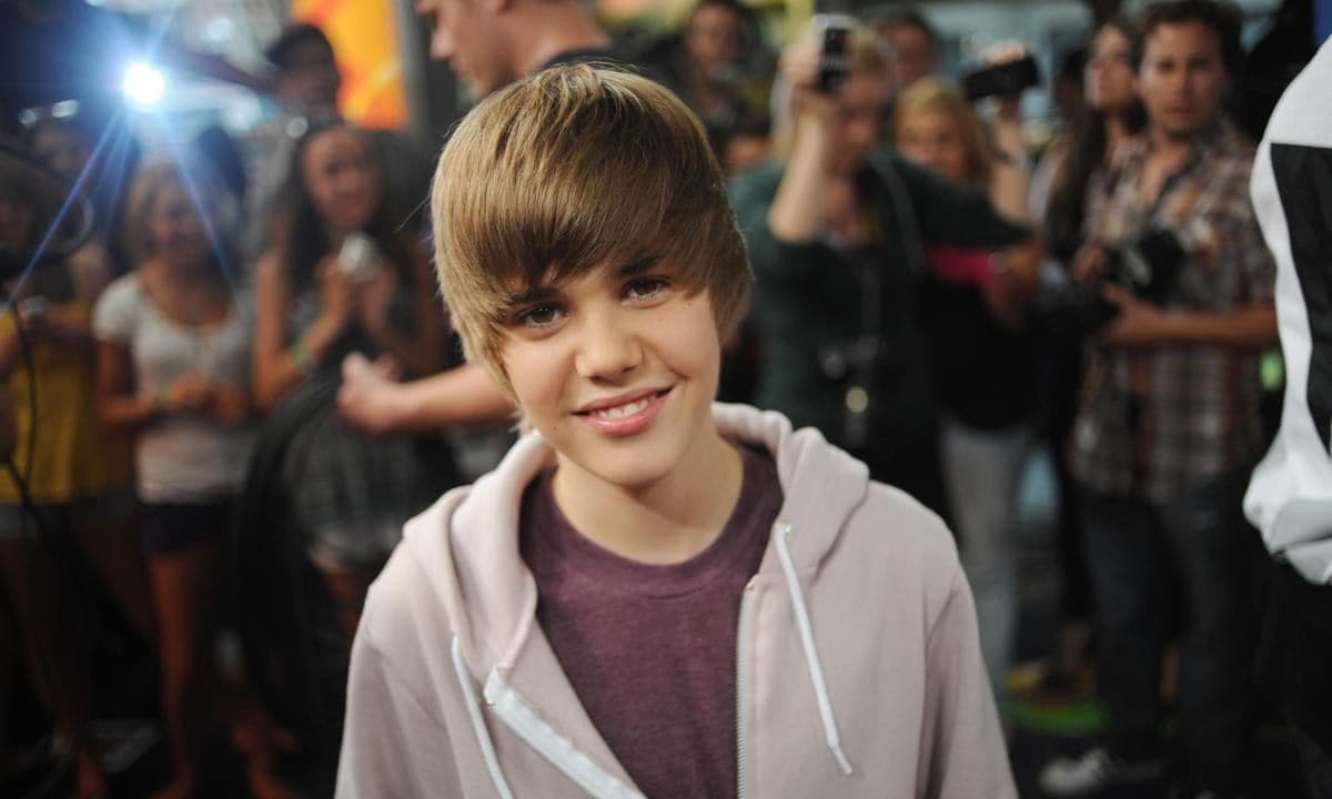 Justin Bieber was only 15 years old when he posed here at the Much Music Environment in 2009. This was the year he released his first album My World that led to his status as a teen idol.