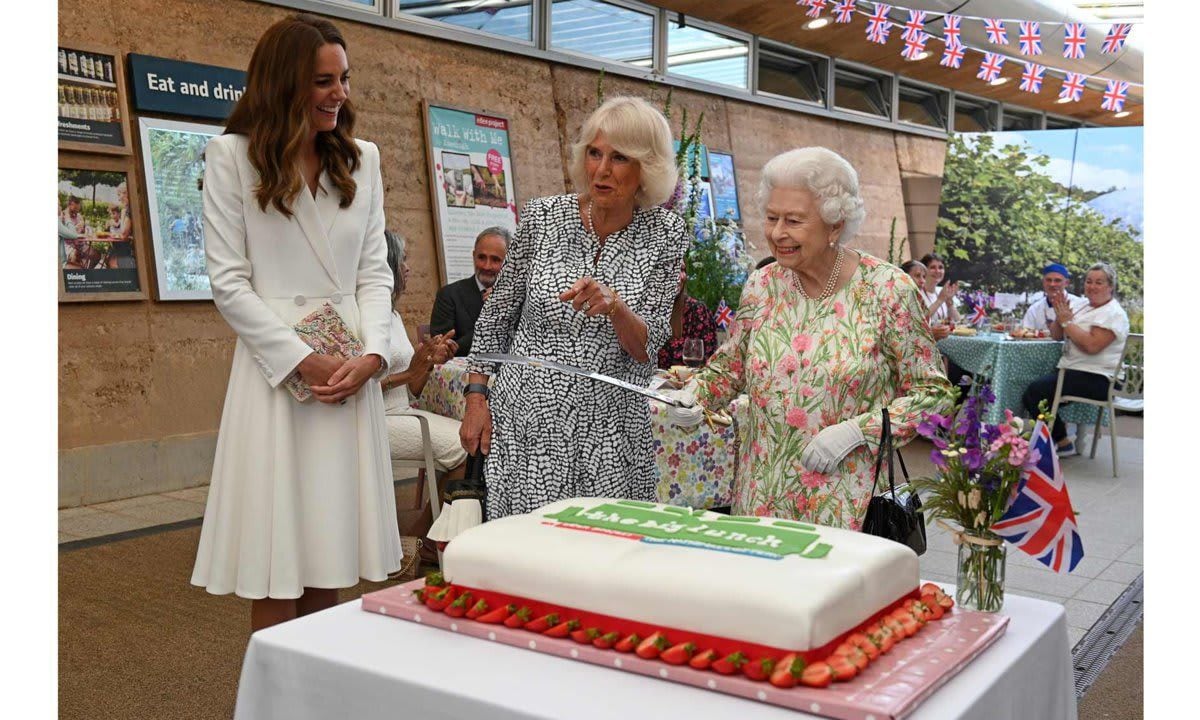 Kate smiled as she watched the Queen cut a cake with a sword at The Eden Project during the G7 Summit on June 11.