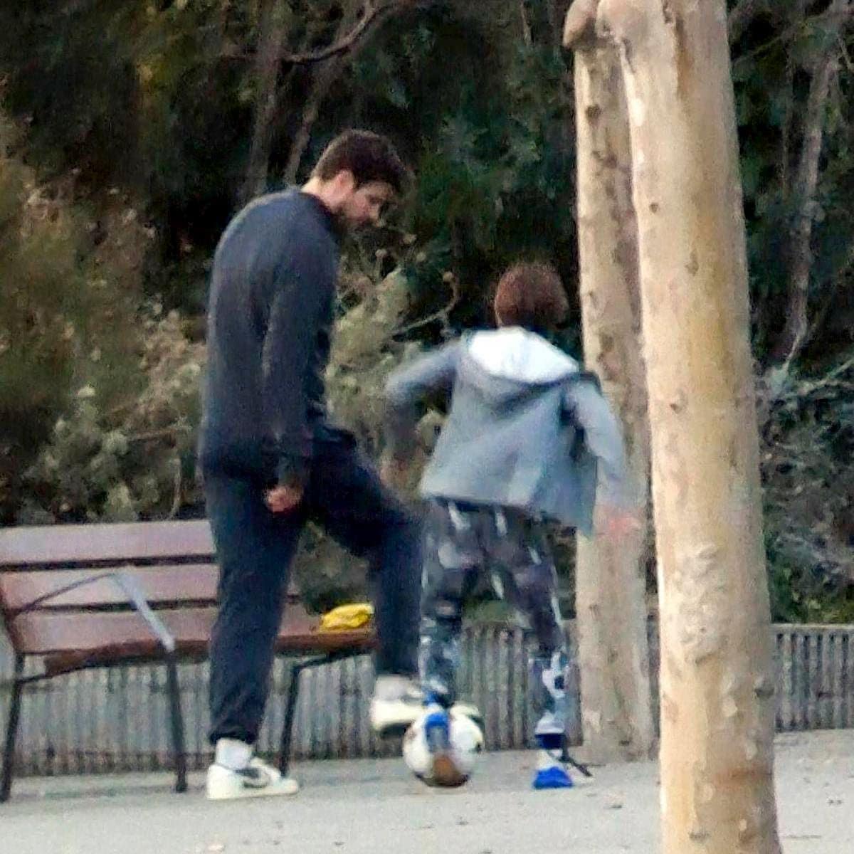 Gerard Pique plays soccer with his son Milan