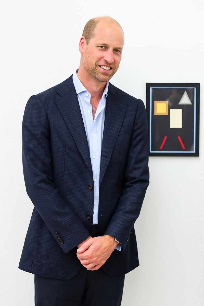 Britain's Prince William, Prince of Wales poses in front of the art piece by Dave Martin called "Sanctuary" during a visit of the exhibition "Homelessness: Reframed", at the Saatchi Gallery, in London, on September 5, 2024. The exhibition brings to life the breadth and complexities of homelessness and aims to help the public to engage with, and better understand, the stories of those who have experienced the issue. (Photo by Chris Jackson / POOL / AFP) / RESTRICTED TO EDITORIAL USE - MANDATORY MENTION OF THE ARTIST UPON PUBLICATION - TO ILLUSTRATE THE EVENT AS SPECIFIED IN THE CAPTION (Photo by CHRIS JACKSON/POOL/AFP via Getty Images)