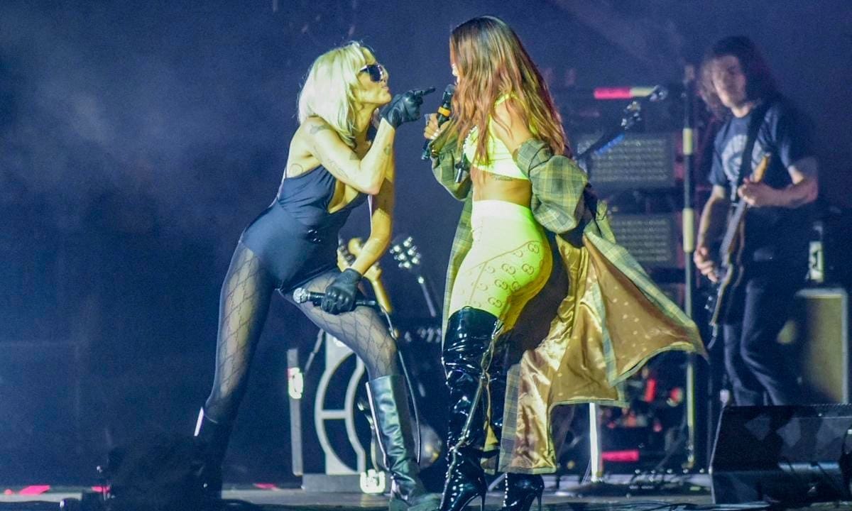 Anitta Joins Miley Cyrus On Stage During Concert Dedicated To Late Foo Fighter's Drummer Taylor Hawkins