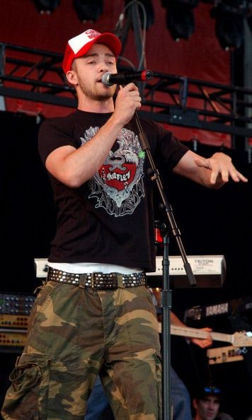 A little edge! It wouldn't be early 2000s fashion or a JT style gallery without the mention of the trucker hat and camo pants during his performance in Ontario, Canada in July 2003.
<br>
Photo: Getty Images