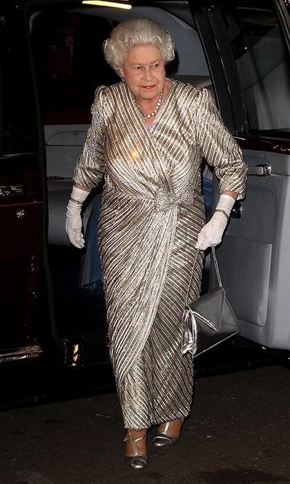 On the throne for 65 years, Queen Elizabeth has seen more than one trend come and go. So for the monarch metallics aren't a passing fad they're a timeless part of her wardrobe. Here the Queen wears a gold wrap gown with silver purse and shoes for a performance at Royal Albert Hall in November 2012.
Photo: Getty Images