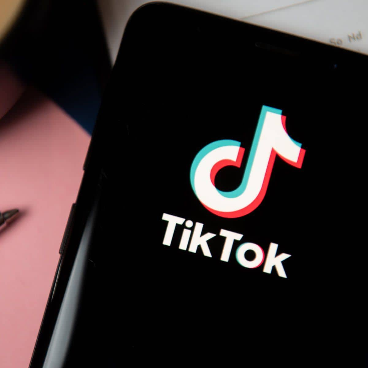 In this photo illustration a TikTok logo displayed on a