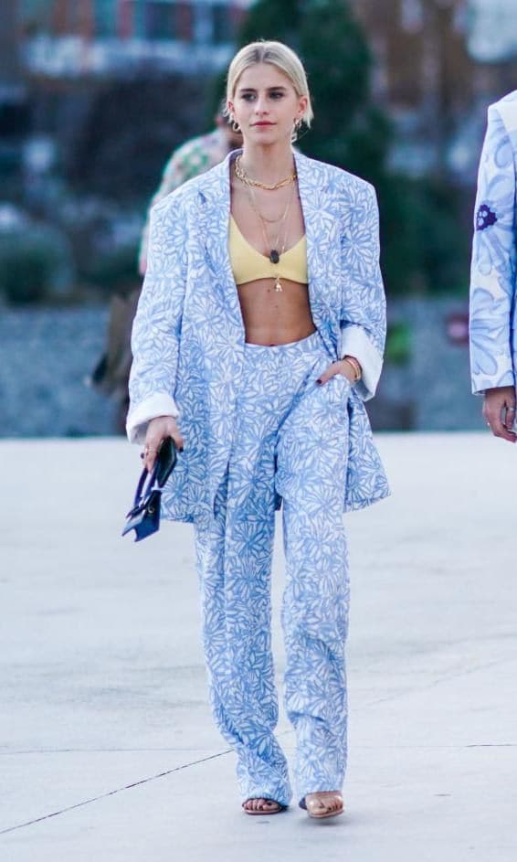 Street style look with exposed bra and blue suit