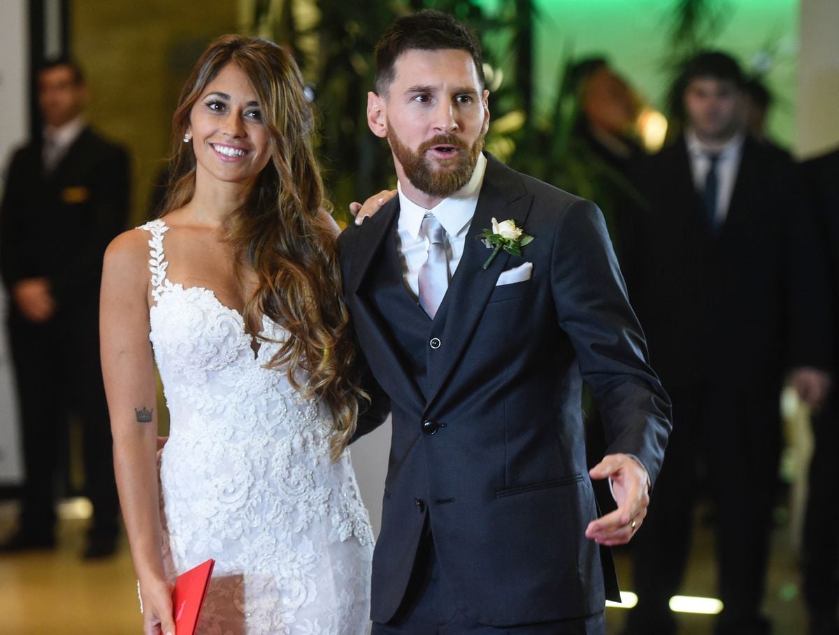 Lionel Messi and Antonela Roccuzzo pose for photographers just after their wedding at the City Centre Complex in Rosario, Santa Fe province, Argentina on June 30, 2017.