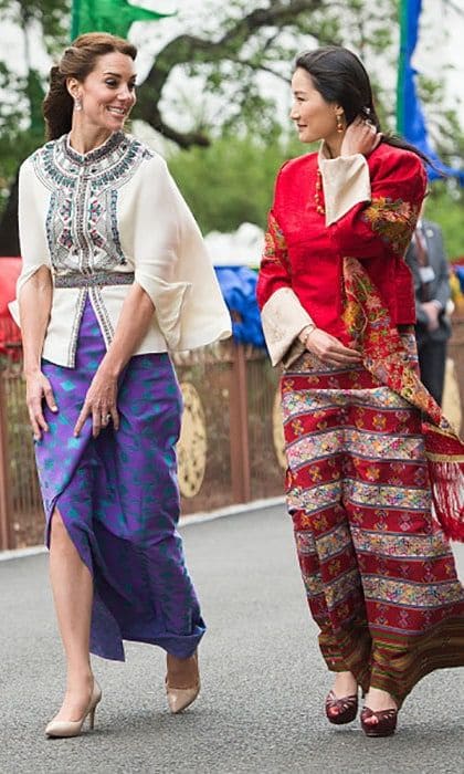 The Duchess took a stroll with the 'Kate Middleton of the Himalayas' Queen Jetsun Pema in a Paul & Joe top and a skirt created from material made in Bhutan. She accessorized the look with lavender Amethyst pear and oval drop earrings from Kiki McDonough.
<br>
Photo: Getty Images