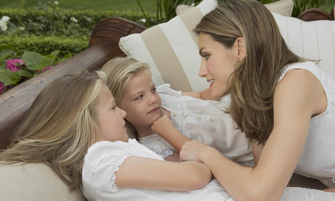 The Queen posed for a tender photo with Leonor and Sofia at Zarzuela Palace in 2012.