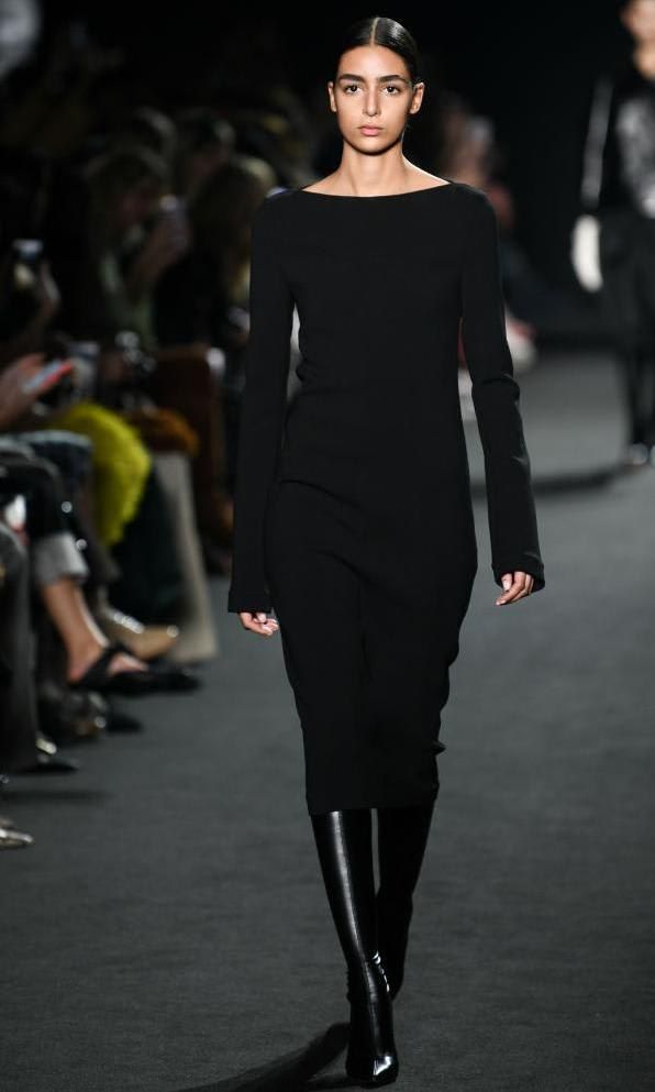 Model with black column dress by Rochas