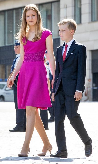 Fifteen-year-old Princess Elisabeth, who is heir to the Belgian throne, attended National Day in Brussels with the royal family wearing a fuchsia day dress with embroidered waistline. Joining her was little brother Prince Emmanuel, 11.
Photo: Getty Images