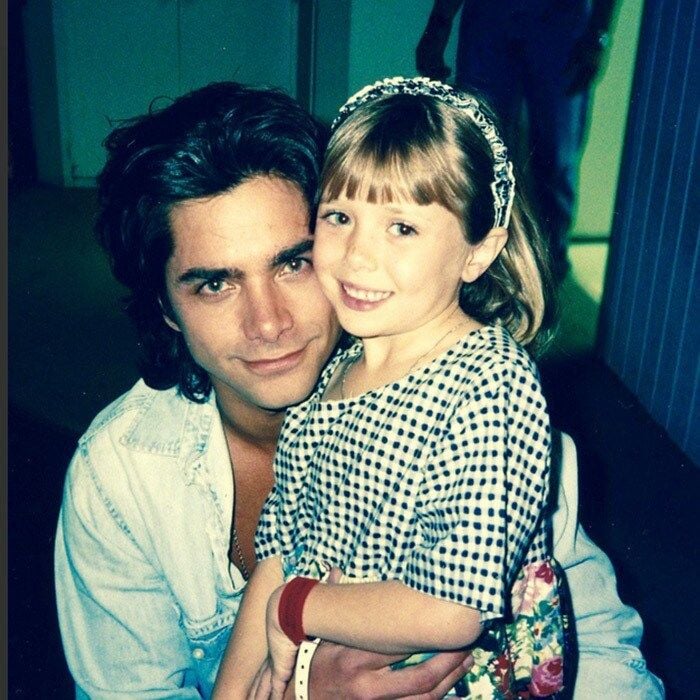 <b>John Stamos with Elizabeth Olsen</b>
Full House? Not exactly! John Stamos poses with the Olsen twins' little sister, Elizabeth.
Photo: Twitter/@johnstamos