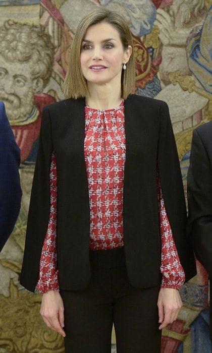 Queen Letizia wears a black cape