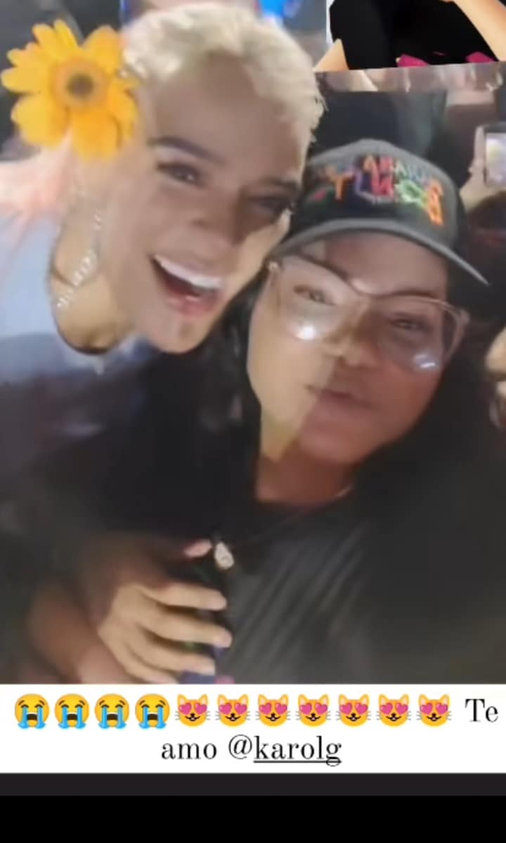 Karol G helps a fan with her gender reveal during the singer’s Dominican Republic concert