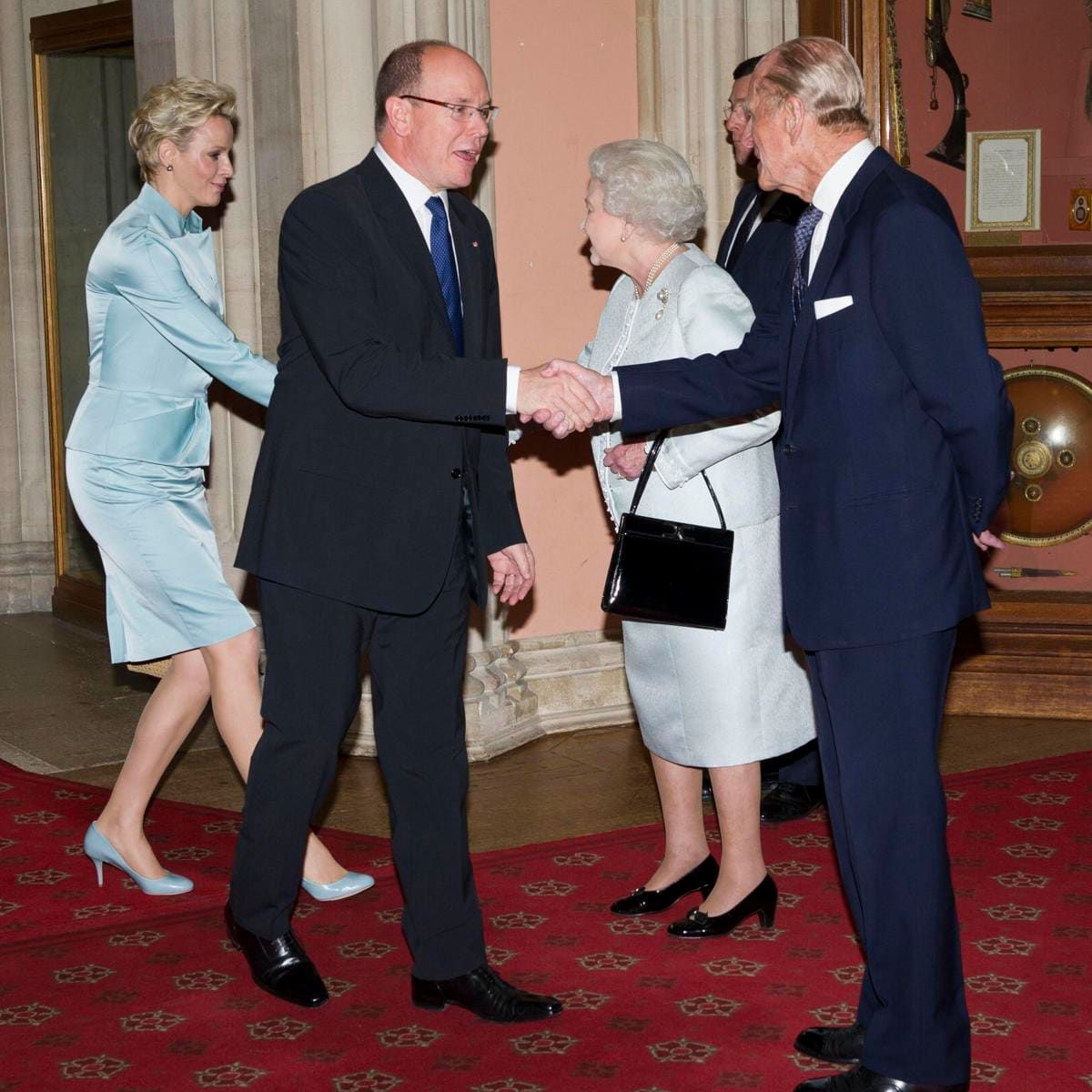 Princess Charlene pictured greeting Queen Elizabeth in 2012