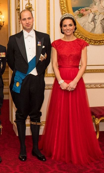 The Duchess of Cambridge looked regal in a bespoke, lace gown by Jenny Packham, which she topped off with the Cambridge Lover's Knot Tiara. The stylish royal recycled the scarlet number for the 2016 Diplomatic Reception held at Buckingham Palace. Kate first wore the dress in 2015 to her first state banquet dinner with Chinese President Xi Jinping and his glamorous wife Peng Liyuan in 2015.
Photo: Dominic Lipinski PA Wire/PA Images