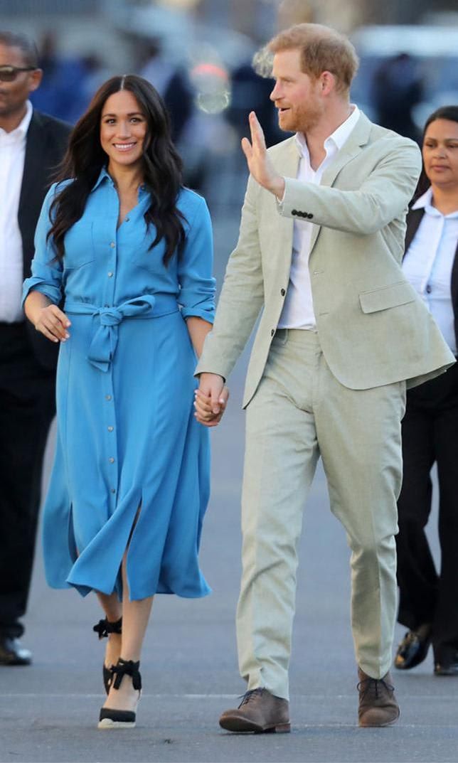 Meghan Markle with blue midi shirt dress by Veronica Beard.