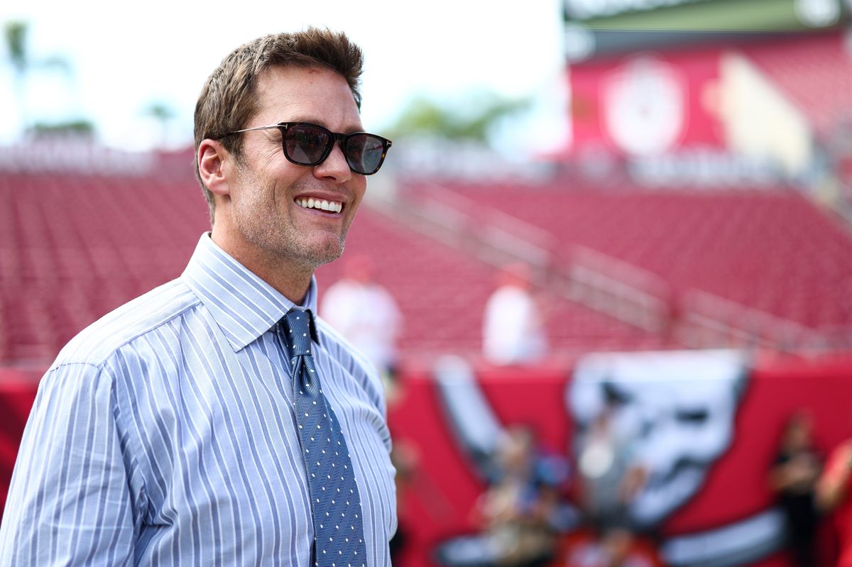 Fox Sports commentator and former NFL quarterback Tom Brady smiles prior to an NFL football game between the Tampa Bay Buccaneers and the Philadelphia Eagles 