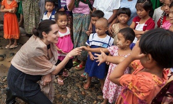 July 30: Angelina Jolie Pitt met with children during a visit to Ja Mai Kaung Baptist refugee camp in Myitkyina, Myanmar.
Photo: Getty Images