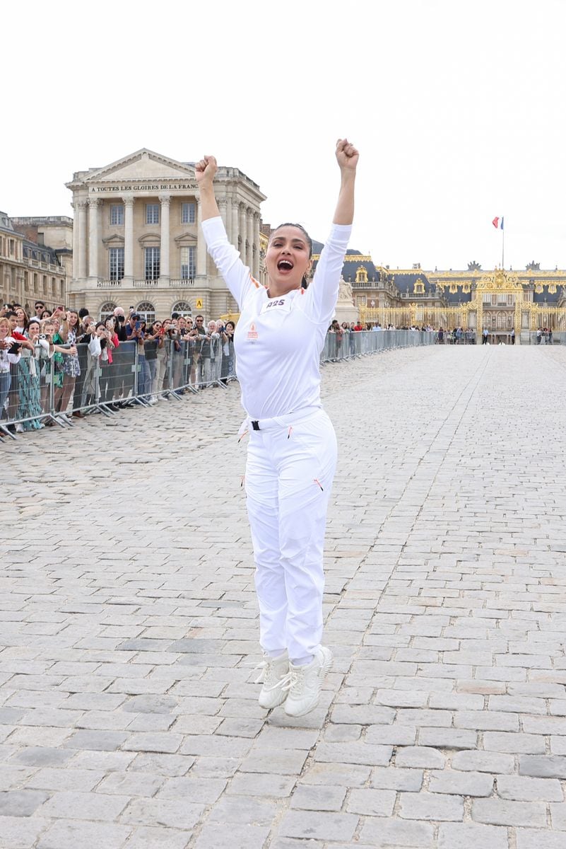  Salma Hayek poses during the Paris Olympics torch relay