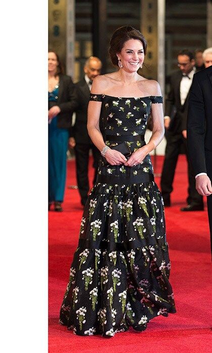 DATE NIGHT
Exuding their own movie-star glamour, the Duke and Duchess of Cambridge made a dramatic entrance at the 70th British Academy Film Awards (the BAFTAs). Kate turned heads in an off-the-shoulder black Alexander McQueen gown embellished with white flowers, while a dapper William wore a tux.
Photo: Getty Images