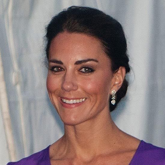 Kate paired her purple v-neck dress with a low chignon with volume at the roots during the Cambridges' visit to Canada.
<br>
Photo: Getty Images