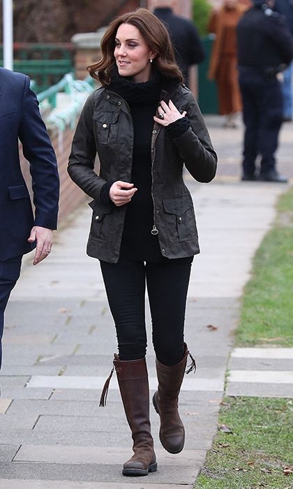 The Duchess of Cambridge went for a casual country look on November 29 as she visited the Robin Hood Primary School in central London. The pregnant royal, who will welcome her third child in April, was cozy and comfy in black jeans, a Barbour jacket and chunky turtleneck sweater by Temperley London. The Duchess finished the look with her trusty flat brown boots by Penelope Chilvers.
Photo: Getty Images