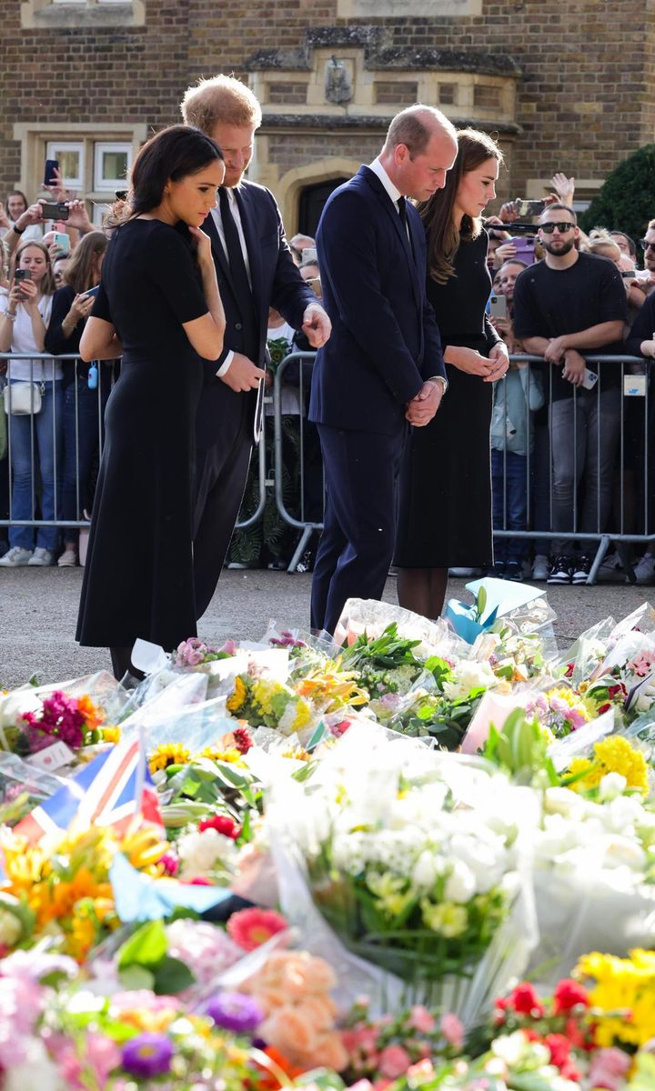 William, Kate, Harry and Meghan viewed tributes left by the public.