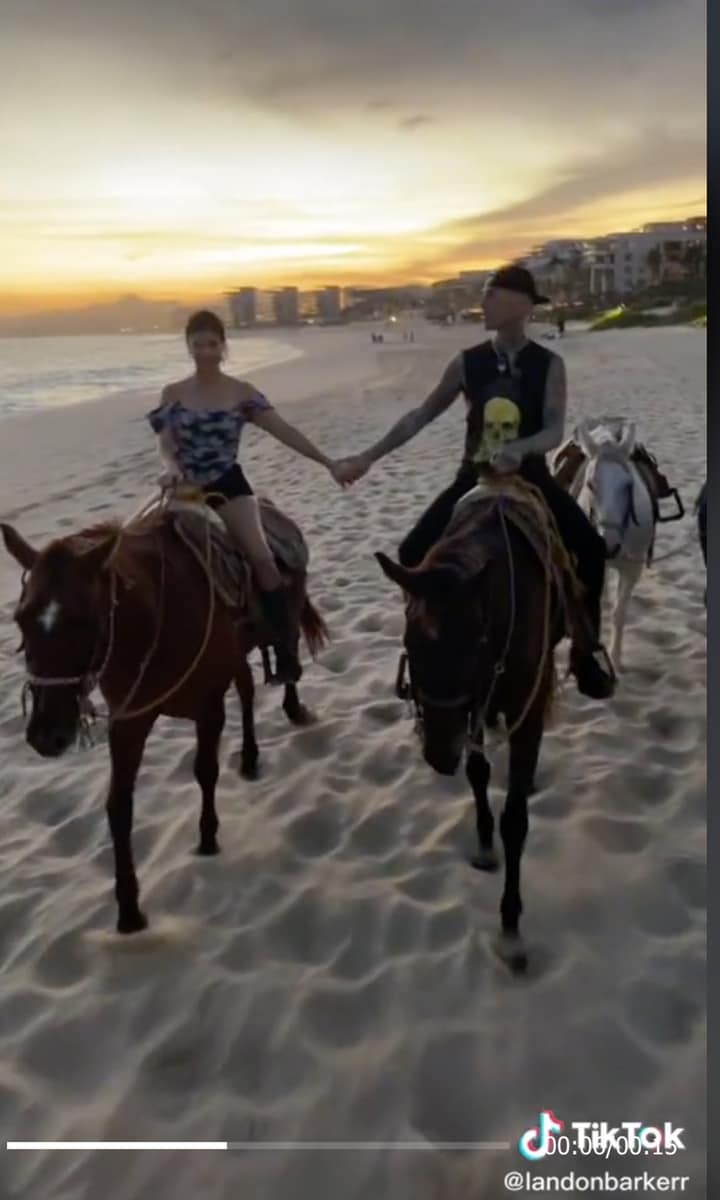 Travis Barker and Kourtney Kardashian hold hands on a romantic horseback ride in Mexico