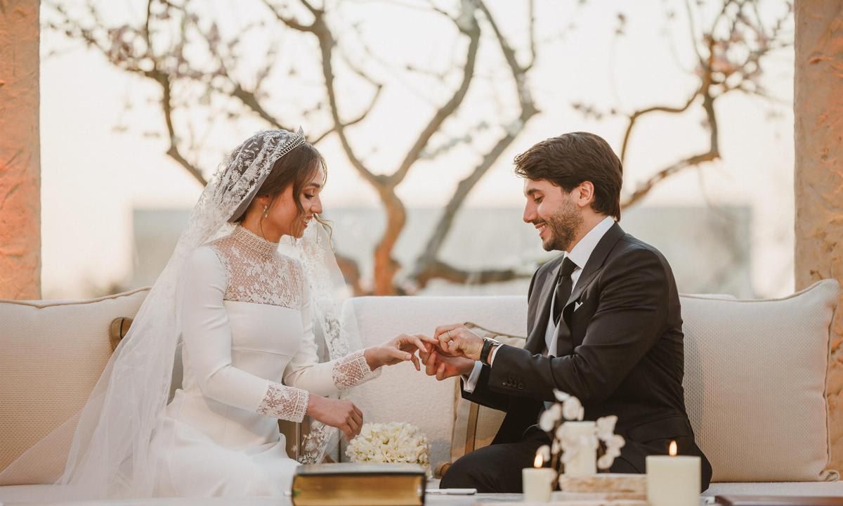 Jameel placed a ring on his bride's finger.