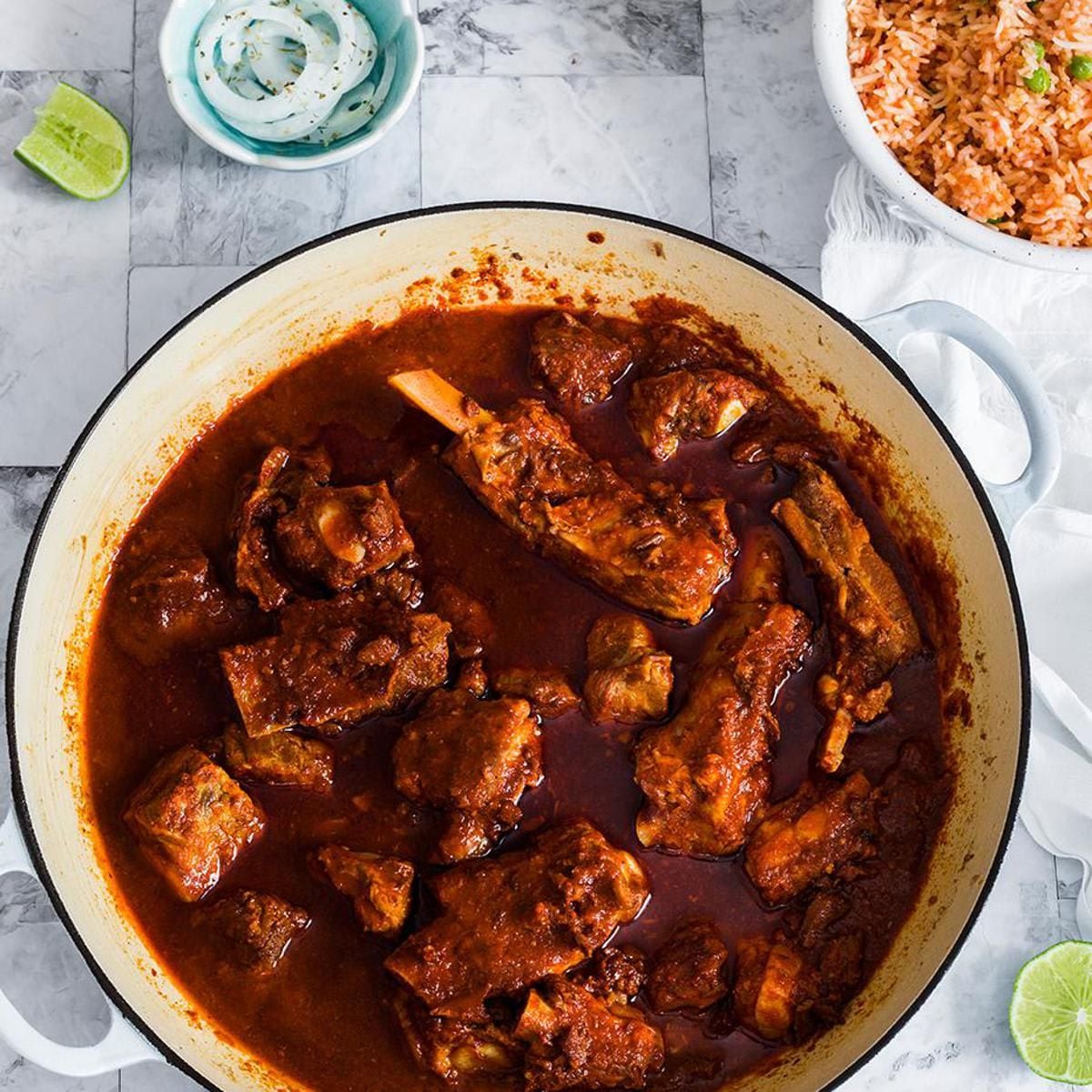 Small pork ribs cooked with adobo sauce and served with rice, tortillas, pickled onions and lime