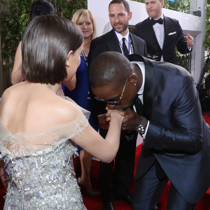 Sterling K. Brown gave Millie a kiss on the hand at the 74th annual Golden Globe Awards.
Photo: Jonathan Leibson/Getty Images for FIJI Water