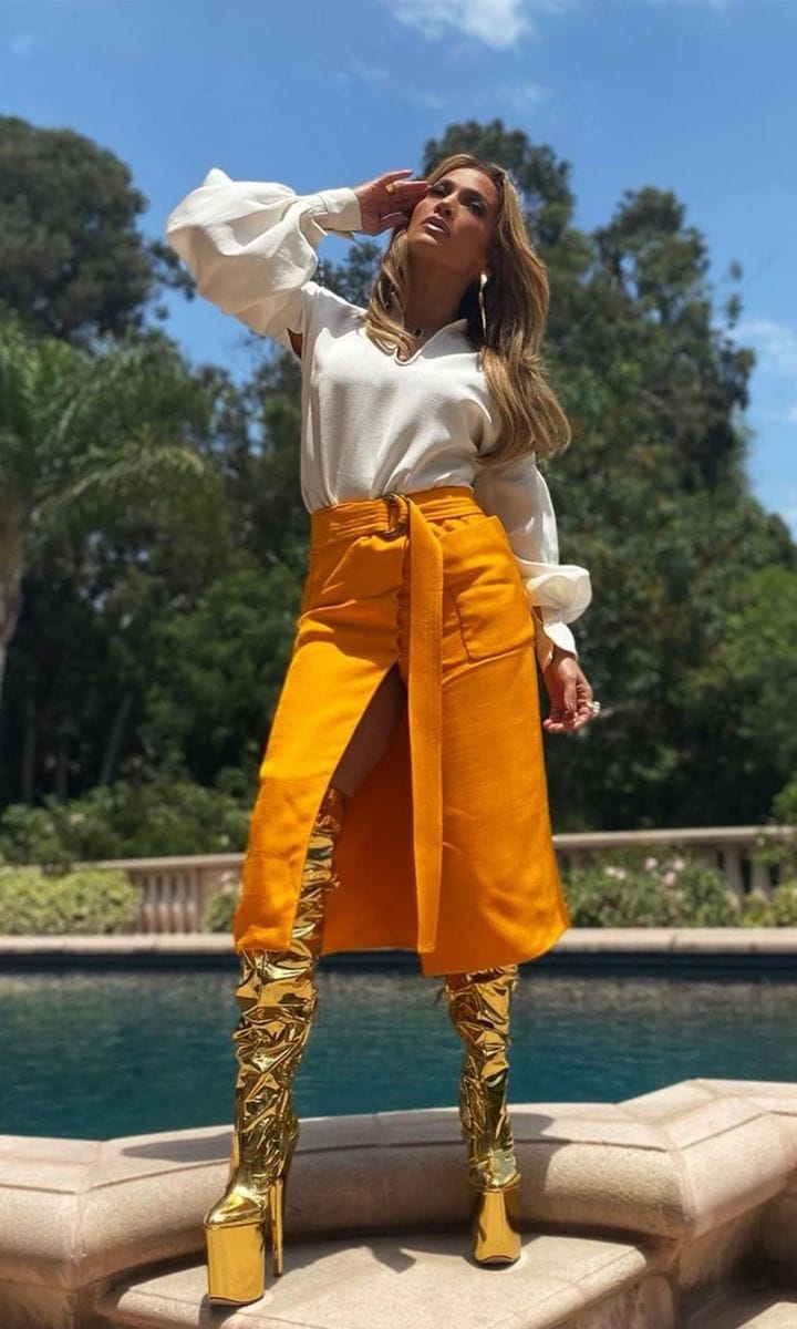 Jennifer Lopez rocks sky high gold boots for 'Fashion Friday'