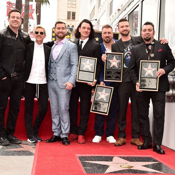 The boys of 'NSYNC reunited for their Hollywood Walk of Fame star ceremony. Lance Bass, JC Chasez, Joey Fatone, Justin Timberlake and Chris Kirkpatrick were joined by Carson Daly and Ellen DeGeneres, who both had fun roasting the group, before they took the stage.
Lance delivered a moving speech where he discussed coming out years after he was in the band. "So many nights on stage, I'd see so many young, gay fans singing their hearts out and I wanted so badly to let you know, I was you," he said. "I just didn't have the strength then. But I do today, and so let me say loud and proud to all my LGBT brothers and sisters, who embrace me and show me the way to be who I am, thank you so much."
Justin Timberlake, who had wife Jessica Biel in the crowd, also took the time to thank their families for their support and his bandmates. "These four guys mean so much to me," he said. "We're really a family and the memories that we have and the times that we've shared and the families that we've built from it ... I don't think I could really put into words how much the four of you mean to me."
After their ceremony and their appearance on <i>The Ellen Show</i>, the group sans Justin Timberlake continued the celebration at Delilah's in West Hollywood with around 200 people. A guest told HELLO!: "Justin was missed, but some of his family was there. It was a night filled with love."
Photo: Getty Images