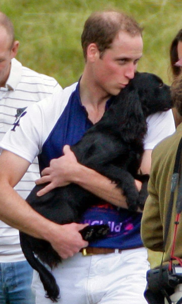 Prince William (pictured with his late pet Lupo) was once chased by a policeman's dog