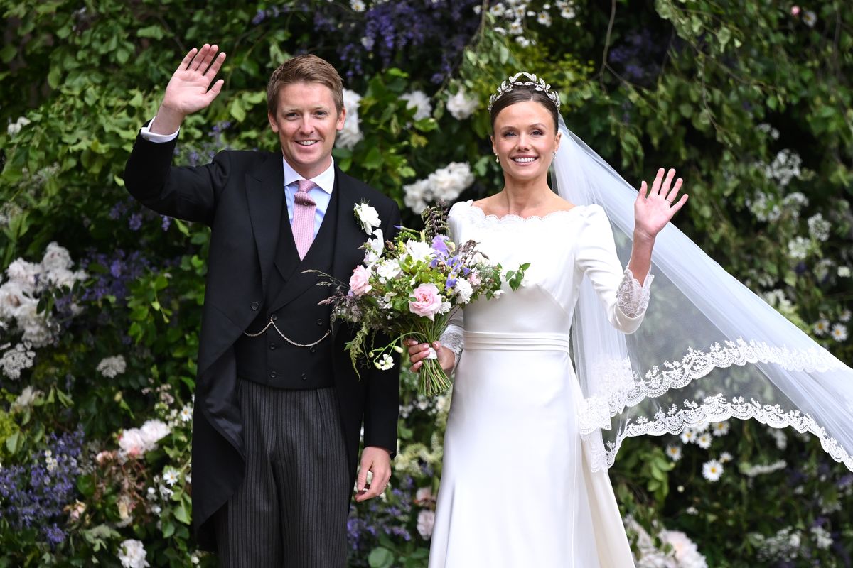 CHESTER, ENGLAND - JUNE 07: Hugh Grosvenor, Duke of Westminster and Olivia Henson, Dutchess of Westminster wave as they depart their wedding as Husband and Wife at Chester Cathedral on June 07, 2024 in Chester, England. (Photo by Samir Hussein/Samir HusseinWireImage)