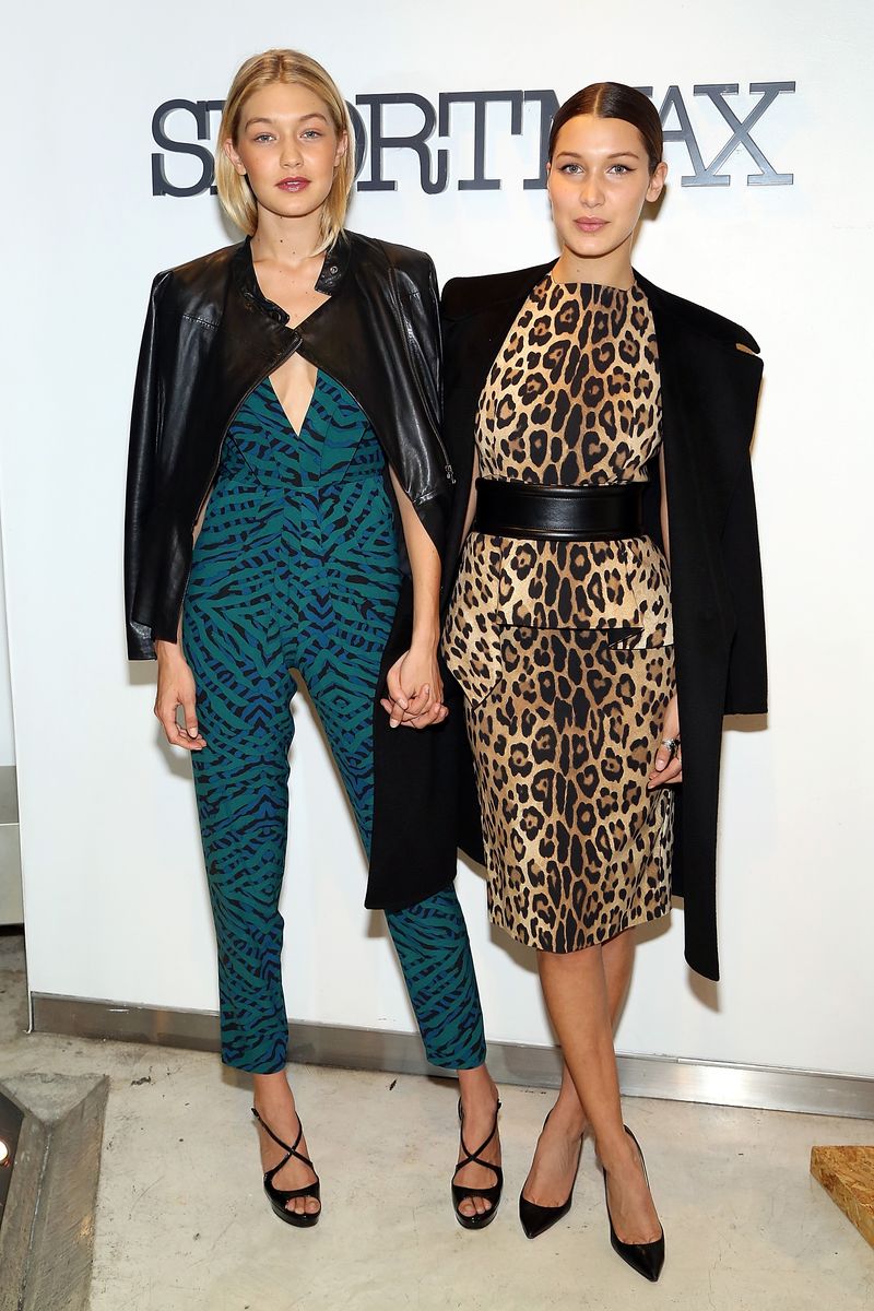 NEW YORK, NY - OCTOBER 28:  Models Gigi Hadid (L) and Bella Hadid attend Sportmax and Teen Vogue Celebrate The Fall/Winter 2014 Collection at Sportmax on October 28, 2014 in New York City.  (Photo by Monica Schipper/Getty Images for Teen Vogue)