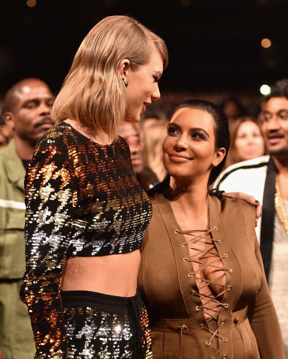 Singer-songwriter Taylor Swift and TV personality Kim Kardashian in the audience during the 2015 MTV Video Music Awards at Microsoft Theater on August 30, 2015 in Los Angeles, California. 