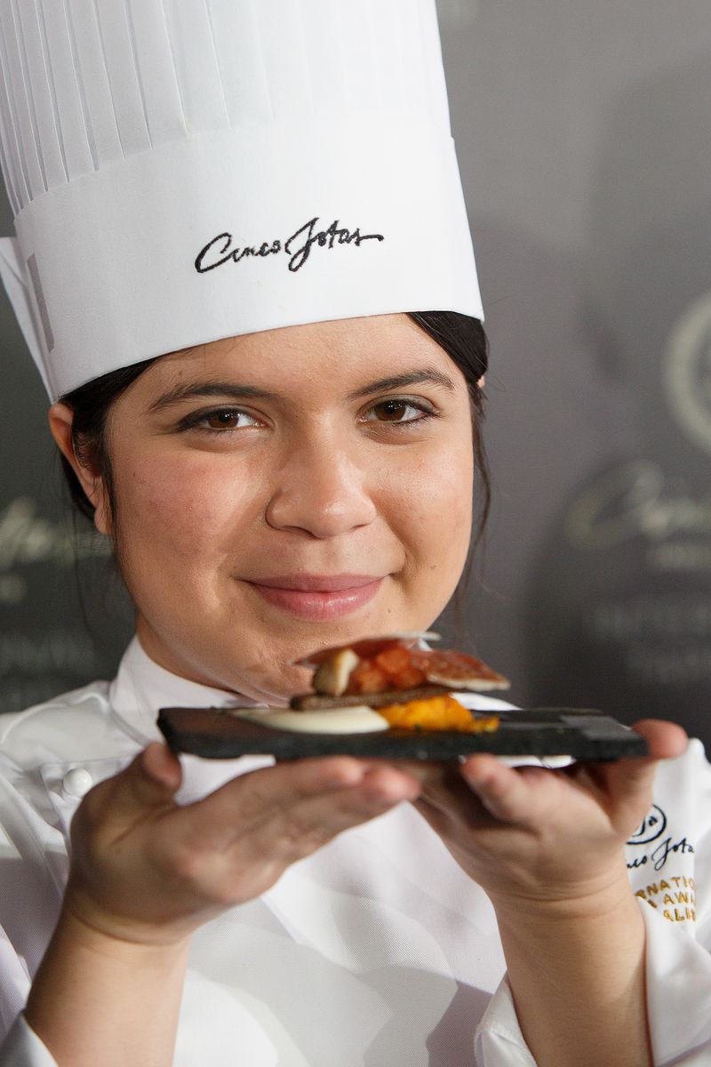 Chef Paulette Tejada from the Le Cordon Bleu College in Miami, United States poses with her tapa as she won the Cinco Jotas International Tapa Award on March 19, 2014 in Madrid, Spain.