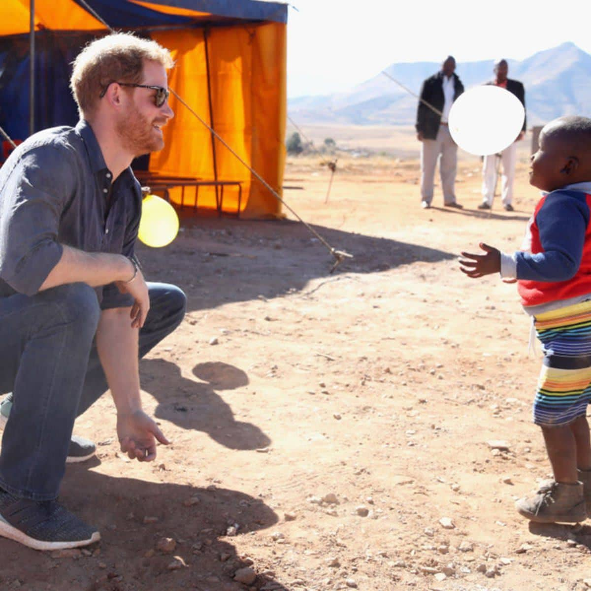 Prince Harry with an African child