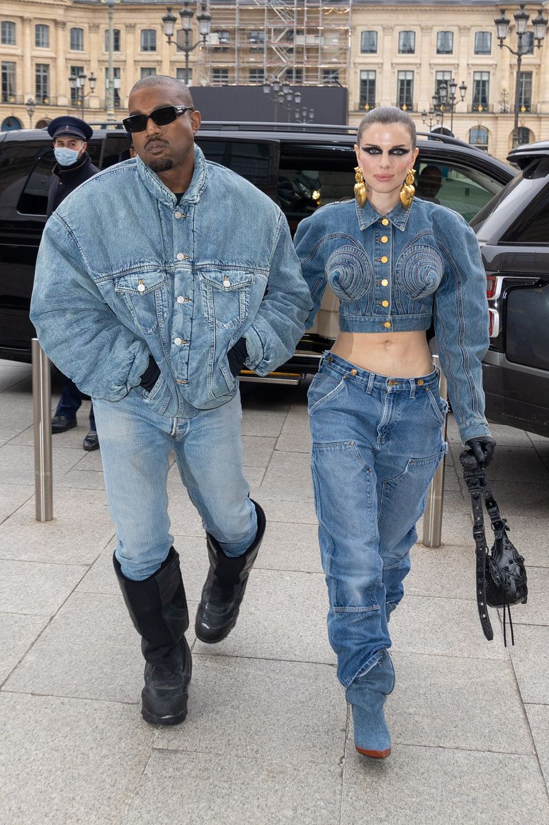 Ye and Julia Fox wearing matching denim styles during Paris Fashion week in 2022.