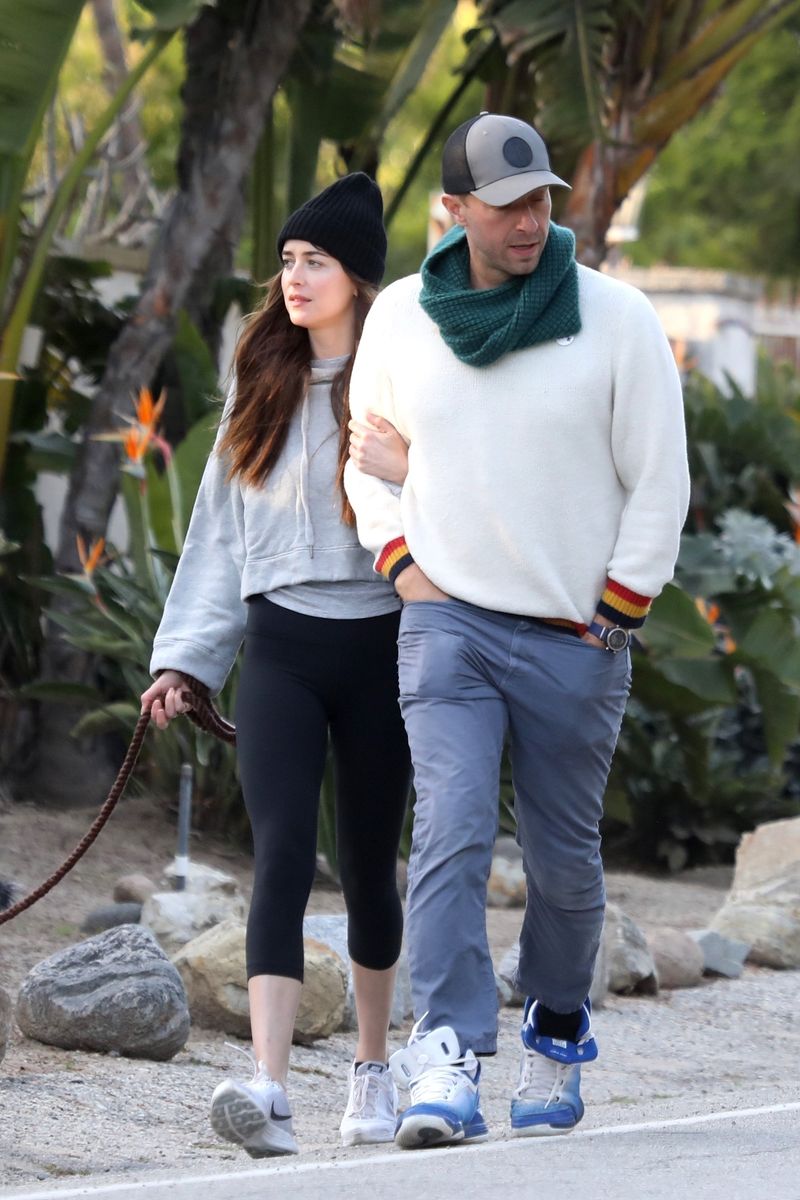 Dakota Johnson and Chris Martin Stroll Hand-in-Hand in Mumbai, Silencing Relationship Rumors